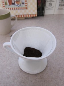 Put the coffee in the filter Put the coffee in the filter