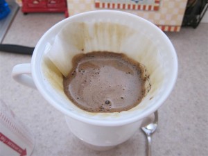 Keep pouring water over the coffee grounds Keep pouring water over the coffee grounds